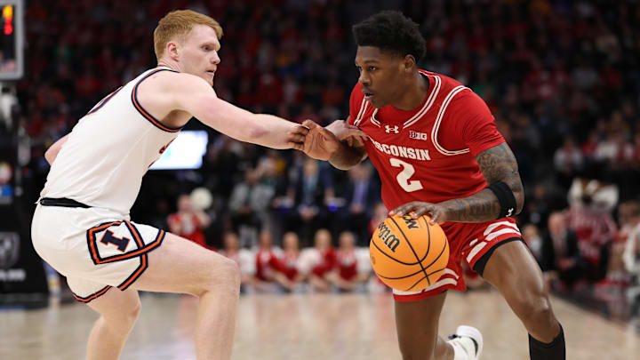 Mar 17, 2024; Minneapolis, MN, USA; Wisconsin Badgers guard AJ Storr (2) plays the ball defender by driving past him to the basket.