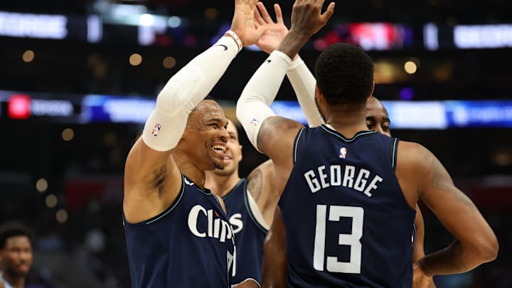 Dec 29, 2023; Los Angeles, California, USA;  Los Angeles Clippers forward Paul George (13) is greet by guard Russell Westbrook (0) after making a three point basket during the third quarter against the Memphis Grizzlies at Crypto.com Arena. Mandatory Credit: Kiyoshi Mio-Imagn Images