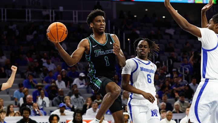 Mar 15, 2025; Fort Worth, TX, USA; Tulane Green Wave forward Kaleb Banks (1) passes the ball ahead of Memphis Tigers guard Baraka Okojie (6) during the first half at Dickies Arena. Mandatory Credit: Chris Jones-Imagn Images
