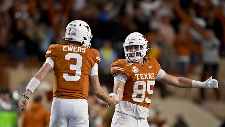Dec 21, 2024; Austin, Texas, USA; Texas Longhorns quarterback Quinn Ewers (3) and tight end Gunnar Helm (85) celebrate during the second half of the CFP National Playoff first round game against the Clemson Tigers at Darrell K Royal-Texas Memorial Stadium. Mandatory Credit: Jerome Miron-Imagn Images
