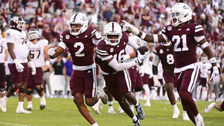 Oct 19, 2024; Starkville, Mississippi, USA; Mississippi State Bulldogs linebacker Zakari Tillman (16) reacts with teammates after an interception against the Texas A&M Aggies during the fourth quarter at Davis Wade Stadium at Scott Field. Mandatory Credit: Matt Bush-Imagn Images