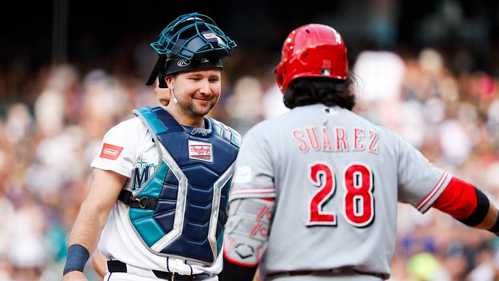 Jul 20, 2026; Seattle, Washington, USA; Seattle Mariners catcher Cal Raleigh (29) greets Cincinnati Reds designated hitter Eugenio Suarez (28) before an at bat by Suarez to begin the second inning at T-Mobile Park. Mandatory Credit: Joe Nicholson-Imagn Images Jul 20, 2026; Seattle, Washington, USA; Seattle Mariners catcher Cal Raleigh (29) greets Cincinnati Reds designated hitter Eugenio Suarez (28) before an at bat by Suarez to begin the second inning at T-Mobile Park. Mandatory Credit: Joe Nicholson-Imagn Images