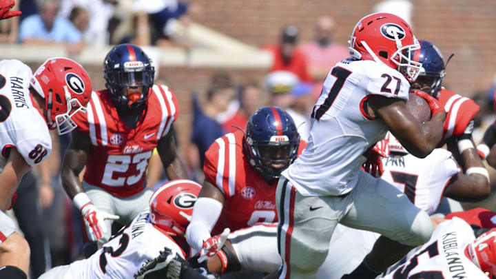 Sep 24, 2016; Oxford, MS, USA; Georgia Bulldogs running back Nick Chubb (27) runs the ball during the second quarter of the game against the Mississippi Rebels at Vaught-Hemingway Stadium. Mandatory Credit: Matt Bush-Imagn Images