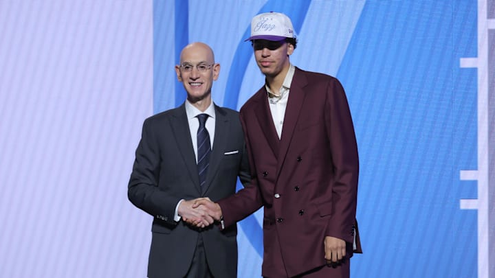 Jun 25, 2025; Brooklyn, NY, USA;  Will Riley stands with NBA commissioner Adam Silver after being selected as the 21st pick by the Utah Jazz in the first round of the 2025 NBA Draft at Barclays Center. Mandatory Credit: Brad Penner-Imagn Images