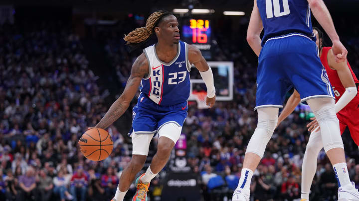 Apr 14, 2024; Sacramento, California, USA; Sacramento Kings guard Keon Ellis (23) dribbles the ball against the Portland Trail Blazers in the third quarter at the Golden 1 Center. Mandatory Credit: Cary Edmondson-USA TODAY Sports