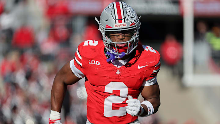 Ohio State Buckeyes safety Caleb Downs runs against the Rutgers Scarlet Knights. Ohio State Buckeyes safety Caleb Downs runs against the Rutgers Scarlet Knights.