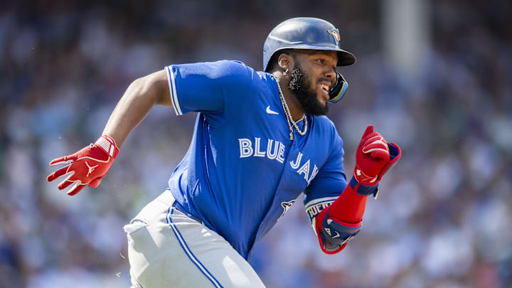 Aug 17, 2024; Chicago, Illinois, USA; Toronto Blue Jays first base Vladimir Guerrero Jr. (27) runs after hitting a double during the fourth inning against the Chicago Cubs at Wrigley Field.