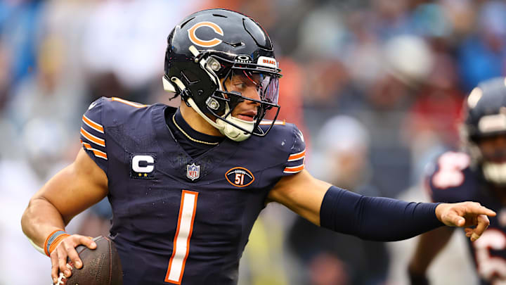 Dec 10, 2023; Chicago, Illinois, USA; Chicago Bears quarterback Justin Fields (1) rushes for a