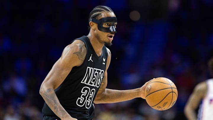 Apr 14, 2024; Philadelphia, Pennsylvania, USA; Brooklyn Nets center Nic Claxton (33) dribbles the ball against the Philadelphia 76ers during the first quarter at Wells Fargo Center. Mandatory Credit: Bill Streicher-Imagn Images