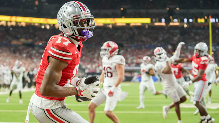 Ohio State Buckeyes wide receiver Carnell Tate (17) makes a catch for a touchdown Saturday, Dec. 6, 2025, during the Big Ten football championship against the Indiana Hoosiers at Lucas Oil Stadium in Indianapolis.