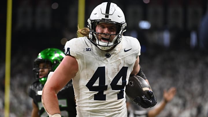 Penn State Nittany Lions tight end Tyler Warren runs for a gain against the Oregon Ducks during the second quarter in the 2024 Big Ten Championship Game at Lucas Oil Stadium.