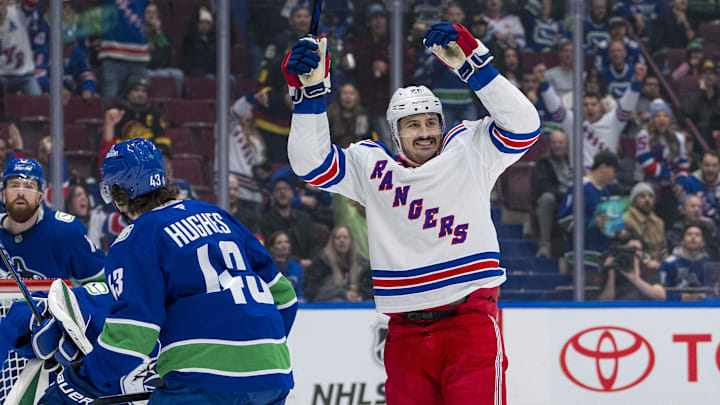 Nov 19, 2024; Vancouver, British Columbia, CAN; Vancouver Canucks defenseman Quinn Hughes (43) watches as New York Rangers forward Chris Kreider (20) celebrates a goal scored by forward Mika Zibanejad (93) during the first period at Rogers Arena. Mandatory Credit: Bob Frid-Imagn Images