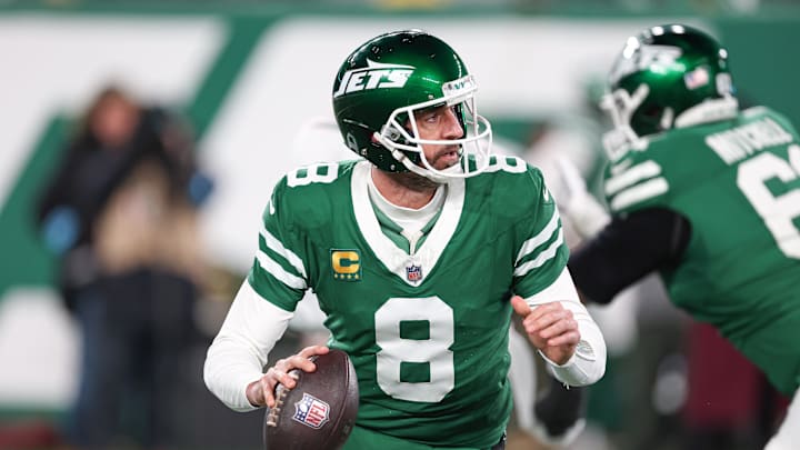 Jan 5, 2025; East Rutherford, New Jersey, USA; New York Jets quarterback Aaron Rodgers (8) rolls out during the first half against the Miami Dolphins at MetLife Stadium. Mandatory Credit: Vincent Carchietta-Imagn Images Jan 5, 2025; East Rutherford, New Jersey, USA; New York Jets quarterback Aaron Rodgers (8) rolls out during the first half against the Miami Dolphins at MetLife Stadium. Mandatory Credit: Vincent Carchietta-Imagn Images