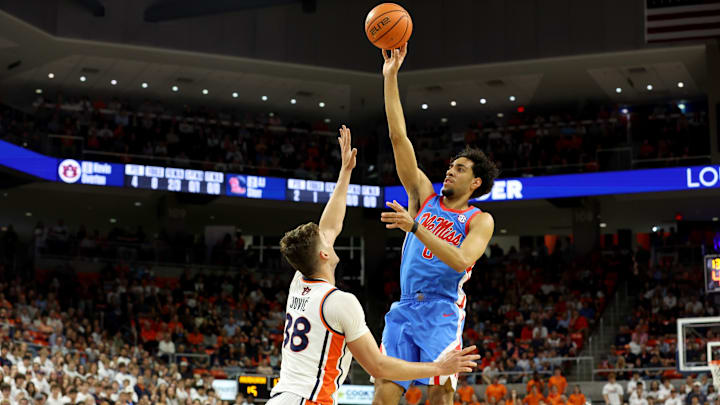 Feb 28, 2026; Auburn, Alabama, USA;  Mississippi Rebels guard Ilias Kamardine (6) takes a shot over Auburn Tigers forward Filip Jovic (38) during the first half at Neville Arena. Mandatory Credit: John Reed-Imagn Images
