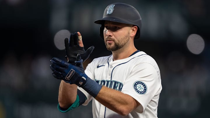 Seattle Mariners catcher Cal Raleigh celebrates after hitting a single against the San Diego Padres on Sept. 11 at T-Mobile Park.