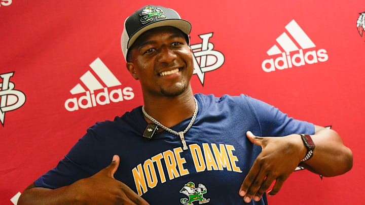 Vero Beach quarterback Wonderful “Champ” Monds IV, a four-star recruit, announces his college decision to attend University of Notre Dame live on the Pat McAfee Show on ESPN, May 1, 2026, at Vero Beach High School along surrounded by family members, teammates and coach Lenny Jankowski. Monds is rated the No. 2 quarterback in Florida and the No. 22 overall recruit in the state on the USA TODAY Florida Network Top 100.