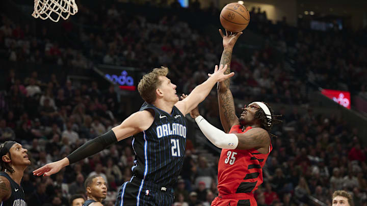 Oct 27, 2023; Portland, Oregon, USA; Portland Trail Blazers center Robert Williams III (35) shoots a basket during the first half against Orlando Magic center Moritz Wagner (21) at Moda Center. Mandatory Credit: Troy Wayrynen-Imagn Images Oct 27, 2023; Portland, Oregon, USA; Portland Trail Blazers center Robert Williams III (35) shoots a basket during the first half against Orlando Magic center Moritz Wagner (21) at Moda Center. Mandatory Credit: Troy Wayrynen-Imagn Images