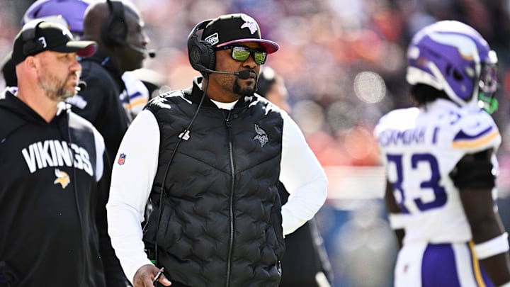 Oct 15, 2023; Chicago, Illinois, USA;  Minnesota Vikings defensive coordinator Brian Flores watches his team play against the Chicago Bears  at Soldier Field. Mandatory Credit: Jamie Sabau-Imagn Images
