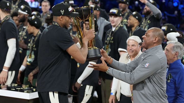 Dec 17, 2024; Las Vegas, Nevada, USA; Milwaukee Bucks forward Giannis Antetokounmpo (34) hands the trophy to head coach Doc Rivers after winning the Emirates NBA Cup championship game against the Oklahoma City Thunder at T-Mobile Arena. Mandatory Credit: Kyle Terada-Imagn Images