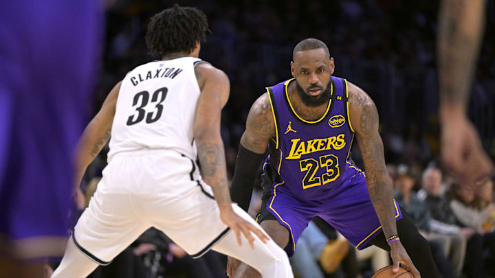 Jan 17, 2025; Los Angeles, California, USA; Brooklyn Nets center Nic Claxton (33) guards Los Angeles Lakers forward LeBron James (23) at Crypto.com Arena. Mandatory Credit: Jayne Kamin-Oncea-Imagn Images Jan 17, 2025; Los Angeles, California, USA; Brooklyn Nets center Nic Claxton (33) guards Los Angeles Lakers forward LeBron James (23) at Crypto.com Arena. Mandatory Credit: Jayne Kamin-Oncea-Imagn Images