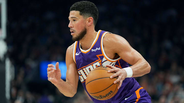 Jan 2, 2026; Phoenix, Arizona, USA; Phoenix Suns guard Devin Booker (1) dribbles against the Sacramento Kings during the first half at Mortgage Matchup Center. Mandatory Credit: Joe Camporeale-Imagn Images Jan 2, 2026; Phoenix, Arizona, USA; Phoenix Suns guard Devin Booker (1) dribbles against the Sacramento Kings during the first half at Mortgage Matchup Center. Mandatory Credit: Joe Camporeale-Imagn Images