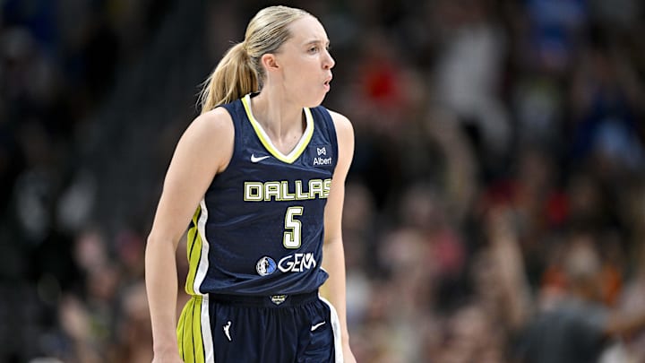 Wings guard Paige Bueckers celebrates during the second half of a loss against the Fever on Friday.