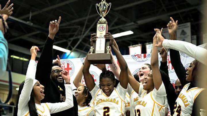 No. 1 Bishop McNamara celebrates its victory over Bishop Ireton in the WCAC Girls Basketball championship game.
