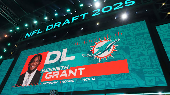 Michigan Wolverines defensive lineman Kenneth Grant is selected as the No. 13 pick by the Miami Dolphins during the NFL Draft at Lambeau Field. Michigan Wolverines defensive lineman Kenneth Grant is selected as the No. 13 pick by the Miami Dolphins during the NFL Draft at Lambeau Field.