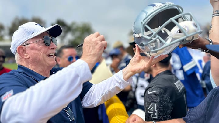 Cowboys owner Jerry Jones signs autographs during training camp at River Ridge Fields in Oxnard on Saturday, July 29, 2023.