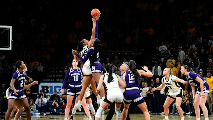 Iowa forward Hannah Stuelke (45) jumps for the tipoff against Northwestern forward Taylor Williams (33) Tuesday, Jan. 28, 2025 at Carver-Hawkeye Arena in Iowa City, Iowa.