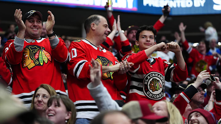 Feb 28, 2026; Denver, Colorado, USA; Chicago Blackhawks fans celebrate a goal scored in the first period against the Colorado Avalancheat Ball Arena. Mandatory Credit: Ron Chenoy-Imagn Images