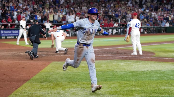 Apr 15, 2024; Phoenix, Arizona, USA; Chicago Cubs second baseman Nico Hoerner celebrates after scoring the tying run. Apr 15, 2024; Phoenix, Arizona, USA; Chicago Cubs second baseman Nico Hoerner celebrates after scoring the tying run.