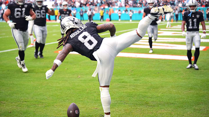 Nov 17, 2024; Miami Gardens, Florida, USA; Las Vegas Raiders running back Ameer Abdullah (8) celebrates a touchdown against the Miami Dolphins in the fourth quarter with a roundhouse kick at Hard Rock Stadium. Mandatory Credit: Jim Rassol-Imagn Images