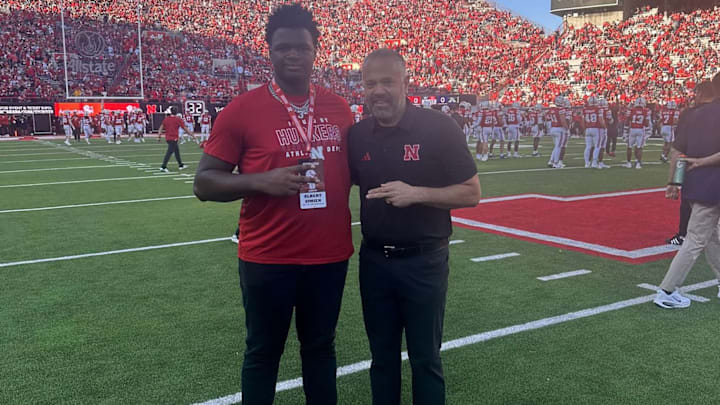 2027 offensive line prospect Albert Simien with coach Matt Rhule on his Nebraska visit.