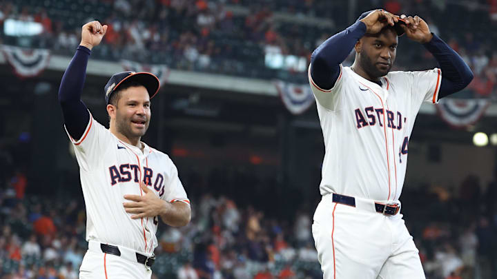 Oct 1, 2024; Houston, Texas, USA; Houston Astros second baseman Jose Altuve (27) and Houston Astros outfielder Yordan Alvarez (44) warm up before playing against the Detroit Tigers in game one of the Wild Card round for the 2024 MLB Playoffs at Minute Maid Park. 