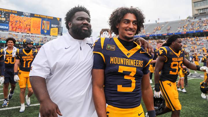 Sep 12, 2026; Morgantown, West Virginia, USA; West Virginia Mountaineers quarterback Michael Hawkins Jr. (3), right, reacts after defeating the UT Martin Skyhawks at Milan Puskar Stadium. Mandatory Credit: Ben Queen-Imagn Images Sep 12, 2026; Morgantown, West Virginia, USA; West Virginia Mountaineers quarterback Michael Hawkins Jr. (3), right, reacts after defeating the UT Martin Skyhawks at Milan Puskar Stadium. Mandatory Credit: Ben Queen-Imagn Images