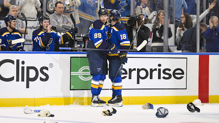 Apr 24, 2025; St. Louis, Missouri, USA; St. Louis Blues left wing Pavel Buchnevich (89) is congratulated by center Robert Thomas (18) after recording a hat trick against the Winnipeg Jets during the third period in game three of the first round of the 2025 Stanley Cup Playoffs at Enterprise Center. Mandatory Credit: Jeff Curry-Imagn Images