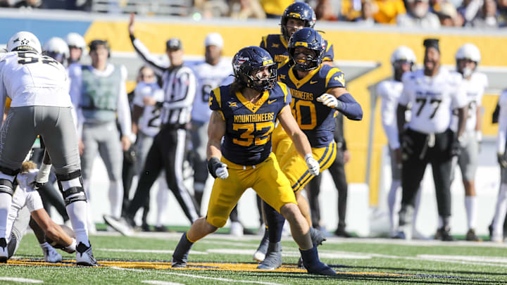 Nov 8, 2025; Morgantown, West Virginia, USA; West Virginia Mountaineers linebacker Ben Bogle (32) celebrates after a sack during the first quarter against the Colorado Buffaloes at Milan Puskar Stadium. Mandatory Credit: Ben Queen-Imagn Images