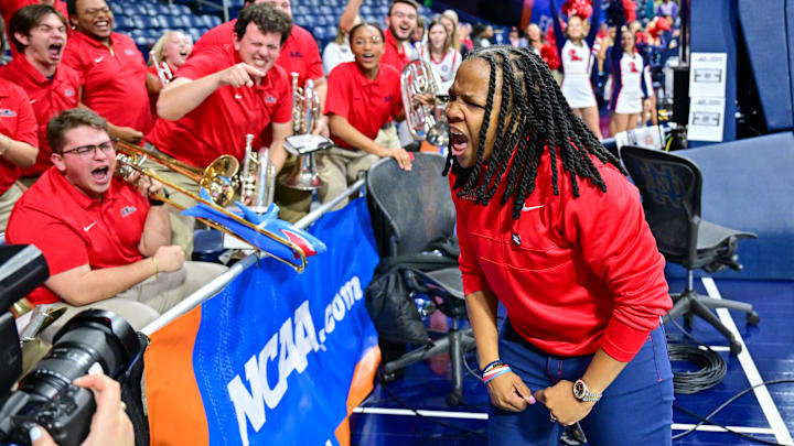 Mar 23, 2024; South Bend, Indiana, USA; Ole Miss Rebels head coach Yolett McPhee-McCuin celebrates with the Ole Miss band after defeating the Marquette Golden Eagles 67-55 in the first round of the NCAA Tournament at the Purcell Pavilion. Mandatory Credit: Matt Cashore-Imagn Images Mar 23, 2024; South Bend, Indiana, USA; Ole Miss Rebels head coach Yolett McPhee-McCuin celebrates with the Ole Miss band after defeating the Marquette Golden Eagles 67-55 in the first round of the NCAA Tournament at the Purcell Pavilion. Mandatory Credit: Matt Cashore-Imagn Images