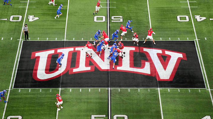 A general overall view as UNLV Rebels quarterback Jayden Maiava (1) throws the ball on the UNLV logo at midfield against the Boise State Broncos in the first half during the Mountain West Championship at Allegiant Stadium. Mandatory Credit: Kirby Lee-Imagn Images A general overall view as UNLV Rebels quarterback Jayden Maiava (1) throws the ball on the UNLV logo at midfield against the Boise State Broncos in the first half during the Mountain West Championship at Allegiant Stadium. Mandatory Credit: Kirby Lee-Imagn Images