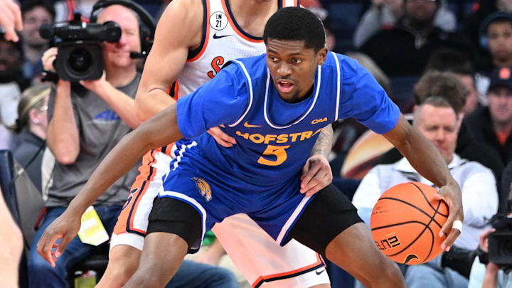 Dec 13, 2025; Syracuse, New York, USA; Hofstra Pride guard Cruz Davis (5) posts up against Syracuse Orange guard Naithan George (11) in the second half at the JMA Wireless Dome. Dec 13, 2025; Syracuse, New York, USA; Hofstra Pride guard Cruz Davis (5) posts up against Syracuse Orange guard Naithan George (11) in the second half at the JMA Wireless Dome.
