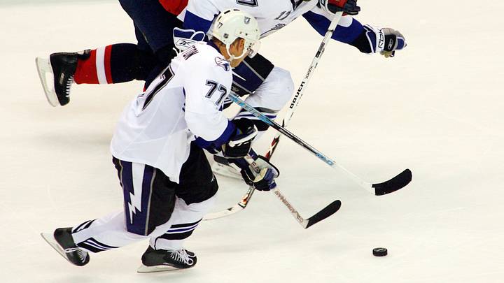 October 24, 2007; Washington, DC, USA; Tampa Bay Lightning center Chris Gratton (77)  and left wing Jan Hlavac (17) advance the puck as Washington Capitals defenseman Milan Jurcina (23) defends in the second period of the Capitals' 5-3 win at Verizon Center in Washington, DC.