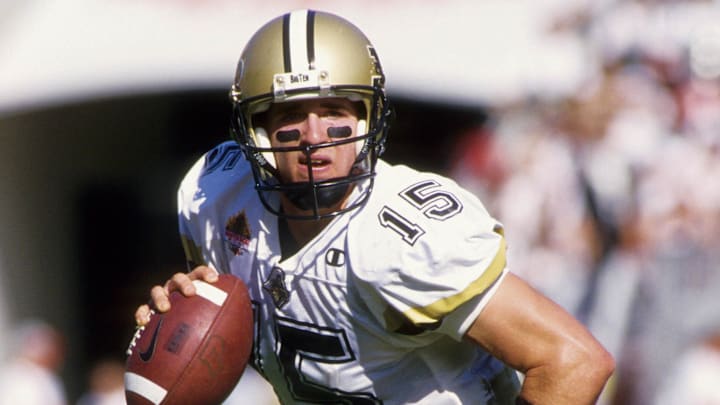 Purdue Boilermakers quarterback Drew Brees (15) scrambling against the Georgia Bulldogs in the Outback Bowl.