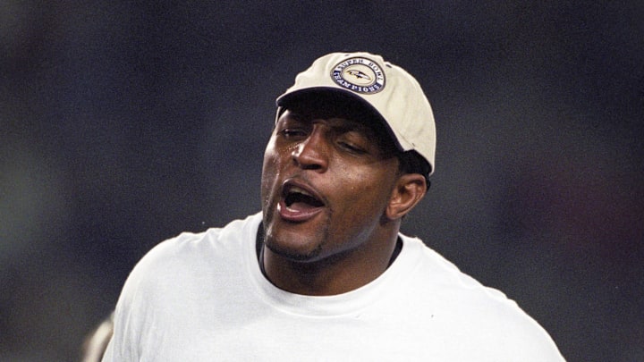 Jan 28, 2001; Tampa, FL, USA; FILE PHOTO; Baltimore Ravens llinebacker Ray Lewis celebrates after defeating the New York Giants during Super Bowl XXXV. The Ravens defeated the Giants 34-7 at Raymond James Stadium. Mandatory Credit: Imagn Images