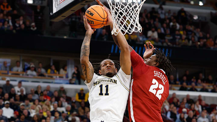 Mar 27, 2026; Chicago, IL, USA; Michigan Wolverines guard Roddy Gayle Jr. (11) shoots while defended by Alabama Crimson Tide forward Aiden Sherrell (22) in the second half during a Sweet Sixteen game of the Midwest Regional of the men's 2026 NCAA Tournament at United Center. Mandatory Credit: Kamil Krzaczynski-Imagn Images