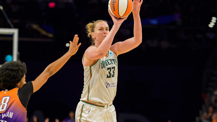 Aug 30, 2025; Phoenix, Arizona, USA; New York Liberty forward Emma Meesseman (33) pulls up from just outside the three point line in the second half to shoot as Phoenix Mercury guard Monique Akoa Makani (8) reacts too late to stop the shot during a game at Footprint Center. Mandatory Credit: Allan Henry-Imagn Images