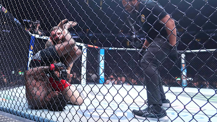 Jun 1, 2024; Newark, New Jersey, USA; Kevin Holland (red gloves) fights Michal Oleksiejczuk (blue gloves) during UFC 302 at Prudential Center. Mandatory Credit: Joe Camporeale-USA TODAY Sports