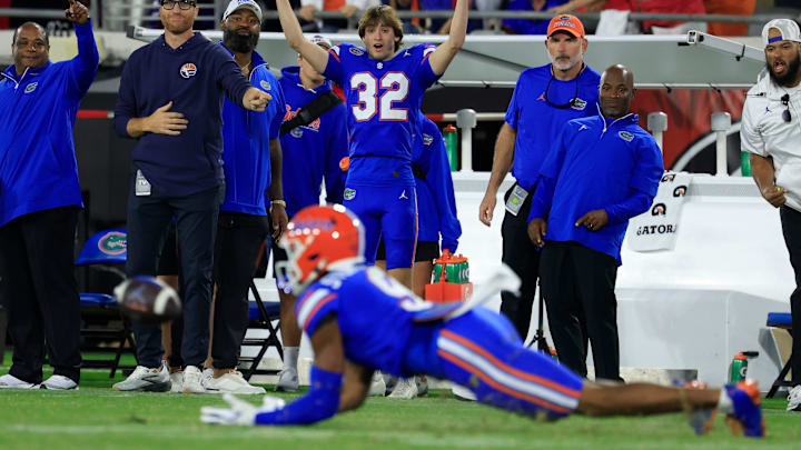 Florida Gators place kicker Evan Noel (32) reacts as wide receiver J. Michael Sturdivant (9) catches the ball but is deemed incomplete, touching the turf, on a critical down during the fourth quarter of an NCAA football game, Saturday, Nov. 1, 2025, at EverBank Stadium in Jacksonville, Fla. Georgia held off Florida 24-20. [Corey Perrine/Florida Times-Union]