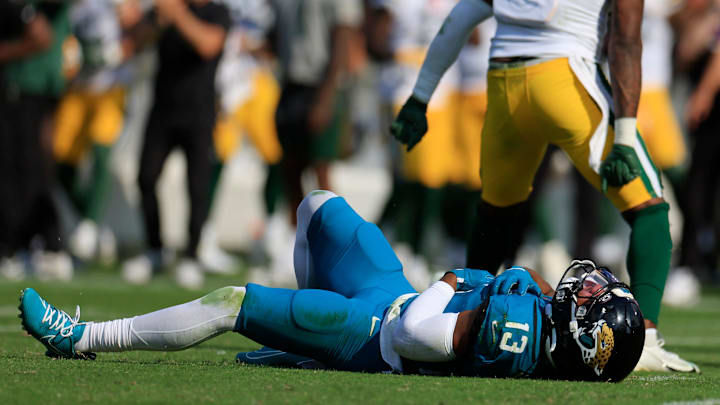 Jacksonville Jaguars wide receiver Christian Kirk (13) lies on the turf after an apparent injury during the fourth quarter of an NFL football matchup Sunday, Oct. 27, 2024 at EverBank Stadium in Jacksonville, Fla. The Packers edged the Jaguars 30-27 on a last-second field goal. [Corey Perrine/Florida Times-Union]