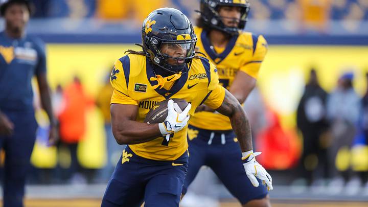Sep 26, 2026; Morgantown, West Virginia, USA; West Virginia Mountaineers running back Cam Cook (4) warms up prior to their game against the Oklahoma State Cowboys at Milan Puskar Stadium. Mandatory Credit: Ben Queen-Imagn Images